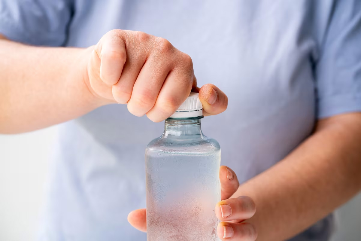 cnn-story Person opening a plastic water bottle